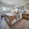 bed with side tables and mirrors